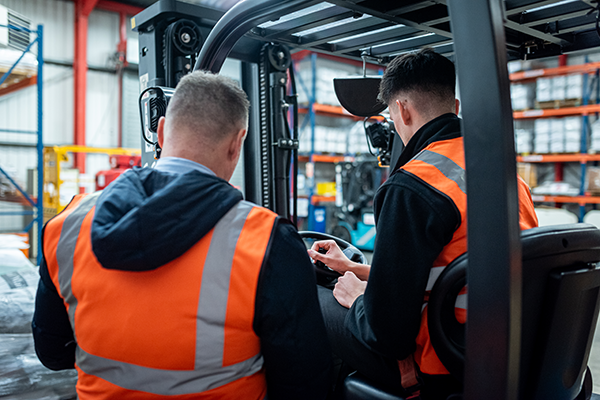 Forklift operators carrying out their safety requirements and responsibilities