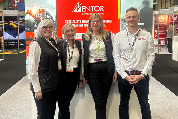 Mebers of the Mentor Training team standing at our exhibition stand during the Health & Safety Event 2025